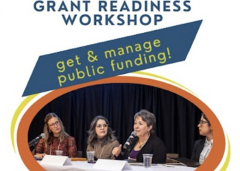 Four speakers seated at a conference table
