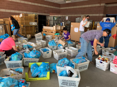 Volunteers sorting food.