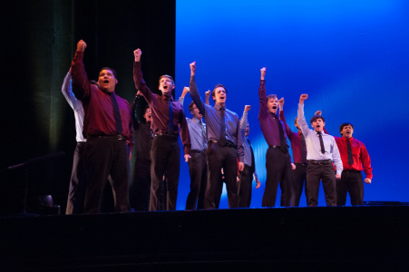 High school students performing on stage in Popejoy Hall