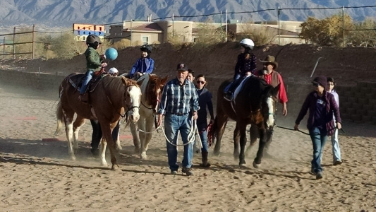 volunteers and riders at loving thunder therapeutic riding