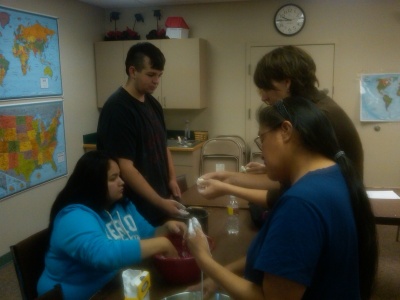 Volunteer Tutors support students with hands on learning